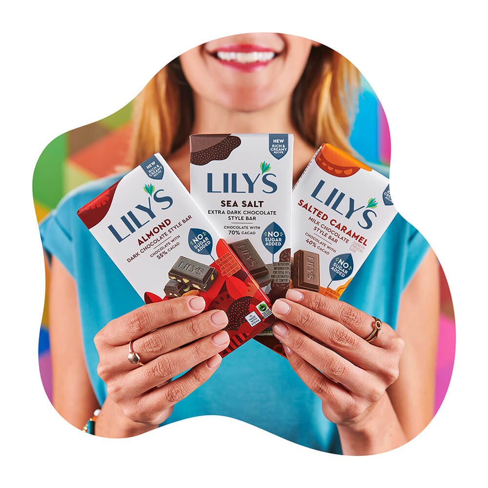 woman holding up three lilys chocolate style bars